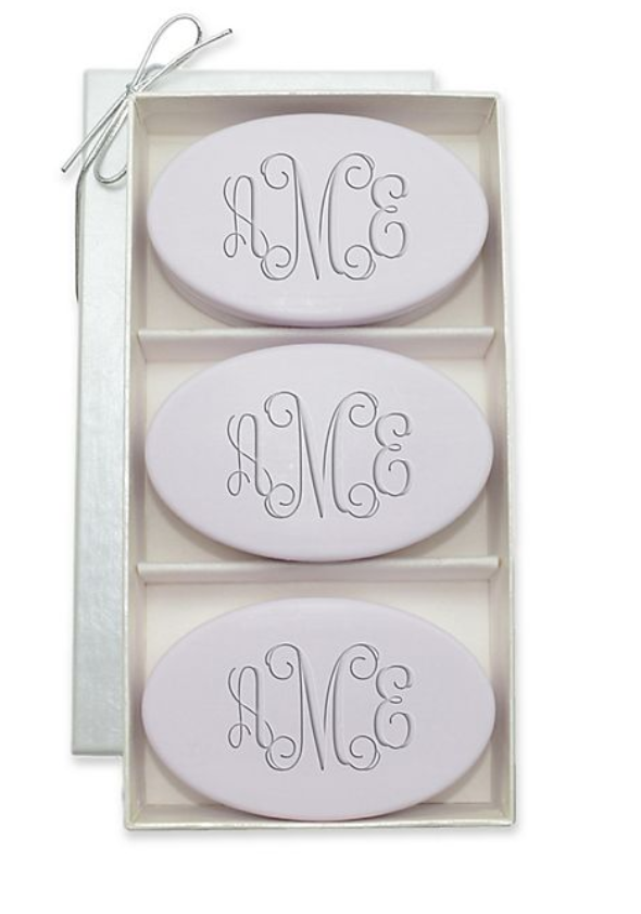 three oval soaps in a luxurious container monogrammed with aMe in purple
