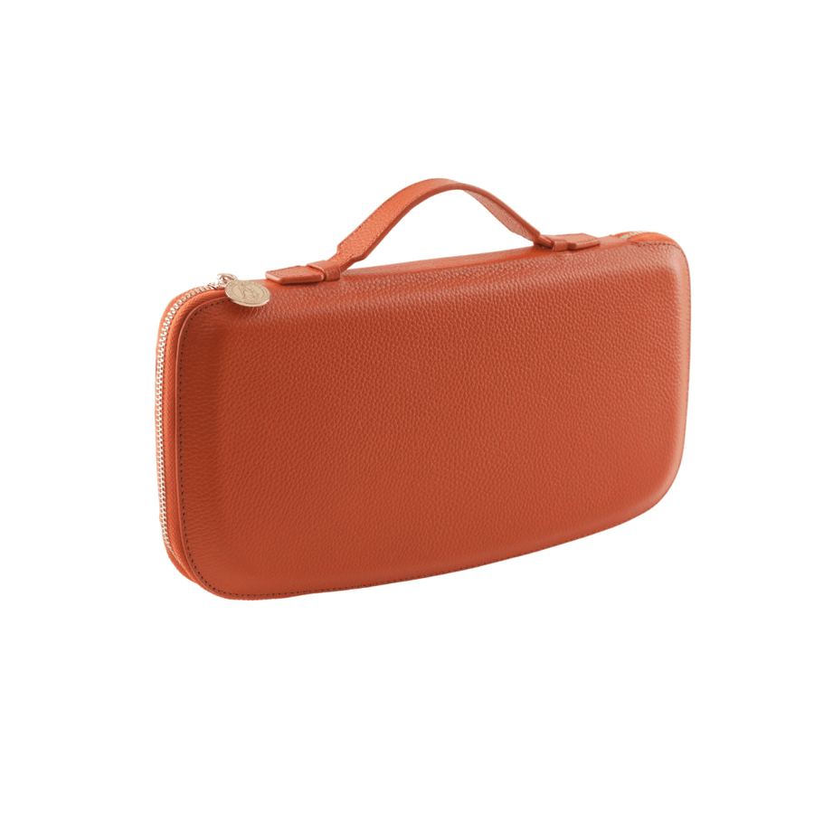 Orange clutch with Genuine Nappa Leather interior and exterior with an injection molded plastic shell to help retain shape and add protection; gold colored zipper wraps all the way around the clutch; Gold colored engraved zipper tag. Stylish gold pen included. Phone pocket, lipstick holder, and place for money.