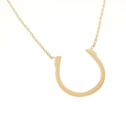 large gold necklace with horseshoe pendant