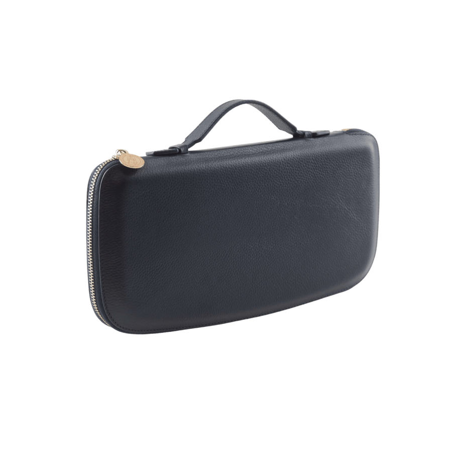 Black clutch with Genuine Nappa Leather interior and exterior with an injection molded plastic shell to help retain shape and add protection; gold colored zipper wraps all the way around the clutch; Gold colored engraved zipper tag.