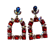 Red, Iridescent, and blue gems on a stirrup shaped set of earrings. Equestrian flair. Statement post earrings